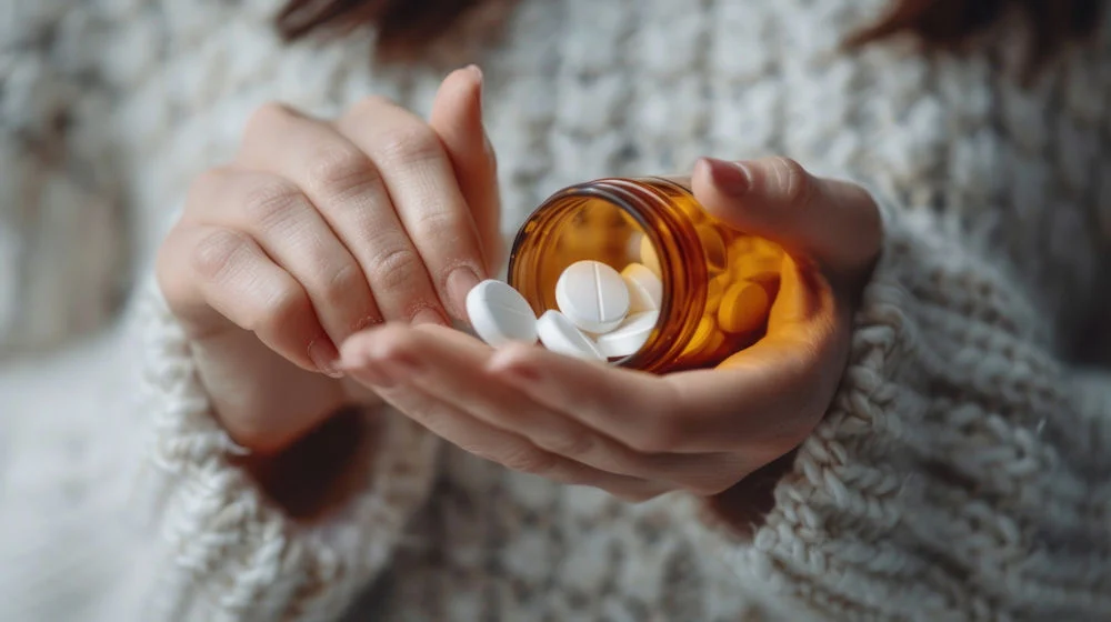 Woman holding a handful of Xanax medication