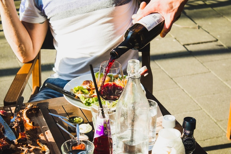 Pouring wine illustrating alcohol addiction vs dependence
