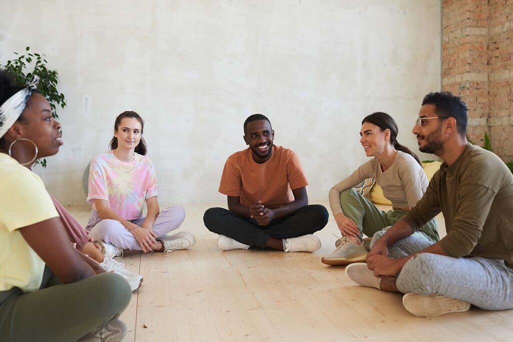 group of clients discussing whats the difference partial hospitalization vs day treatment programs