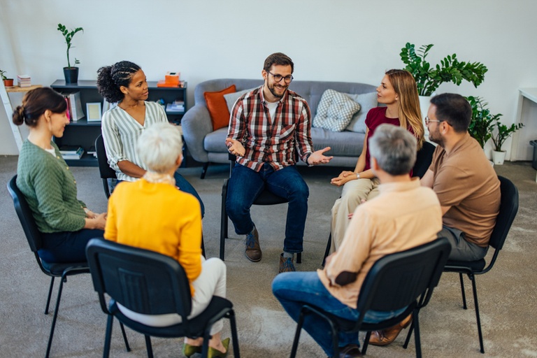 A therapist explaining how to pay for the average cost of partial hospitalization programs.