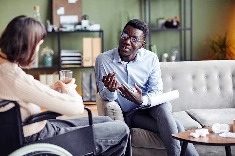 Patient and therapist discussing the importance of therapy