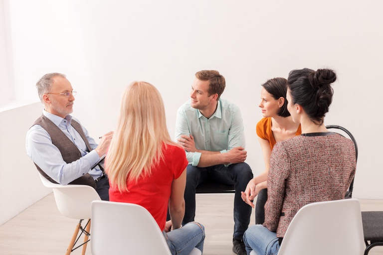 Group session on pharmacotherapy treatments for addiction recovery