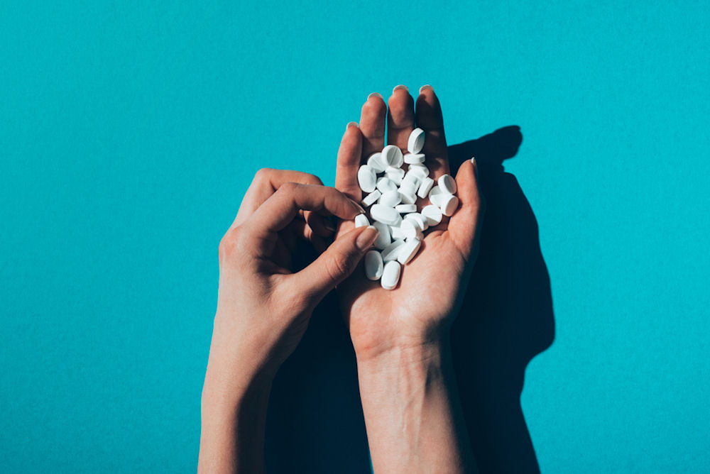 A handful of Xanax, illustrating the dangers of mixing with alcohol