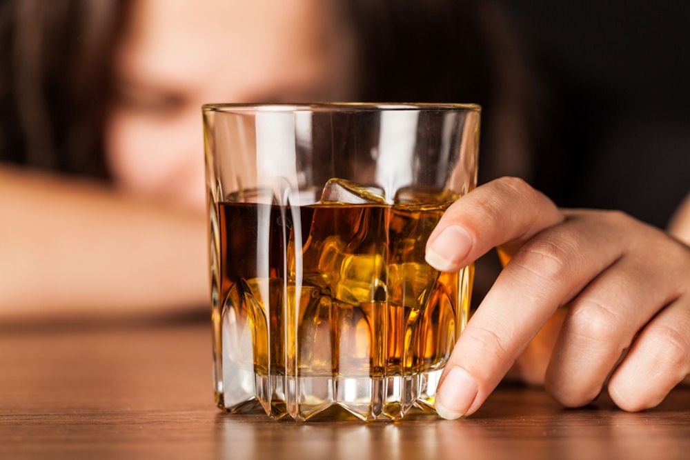 Woman exploring the dangers of binge drinking