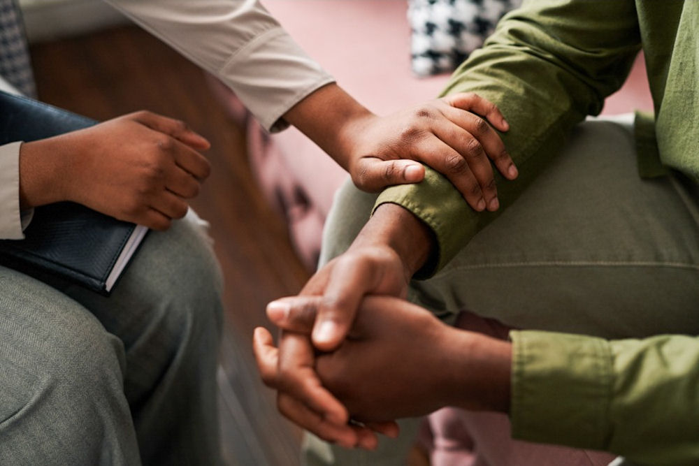 a woman comforting a man with bipolar disorder