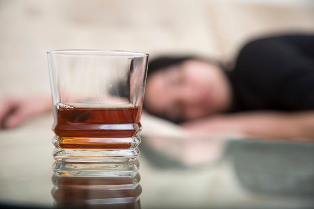 A woman struggling with alcohol consumption