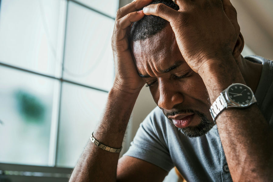 a man with hands on head